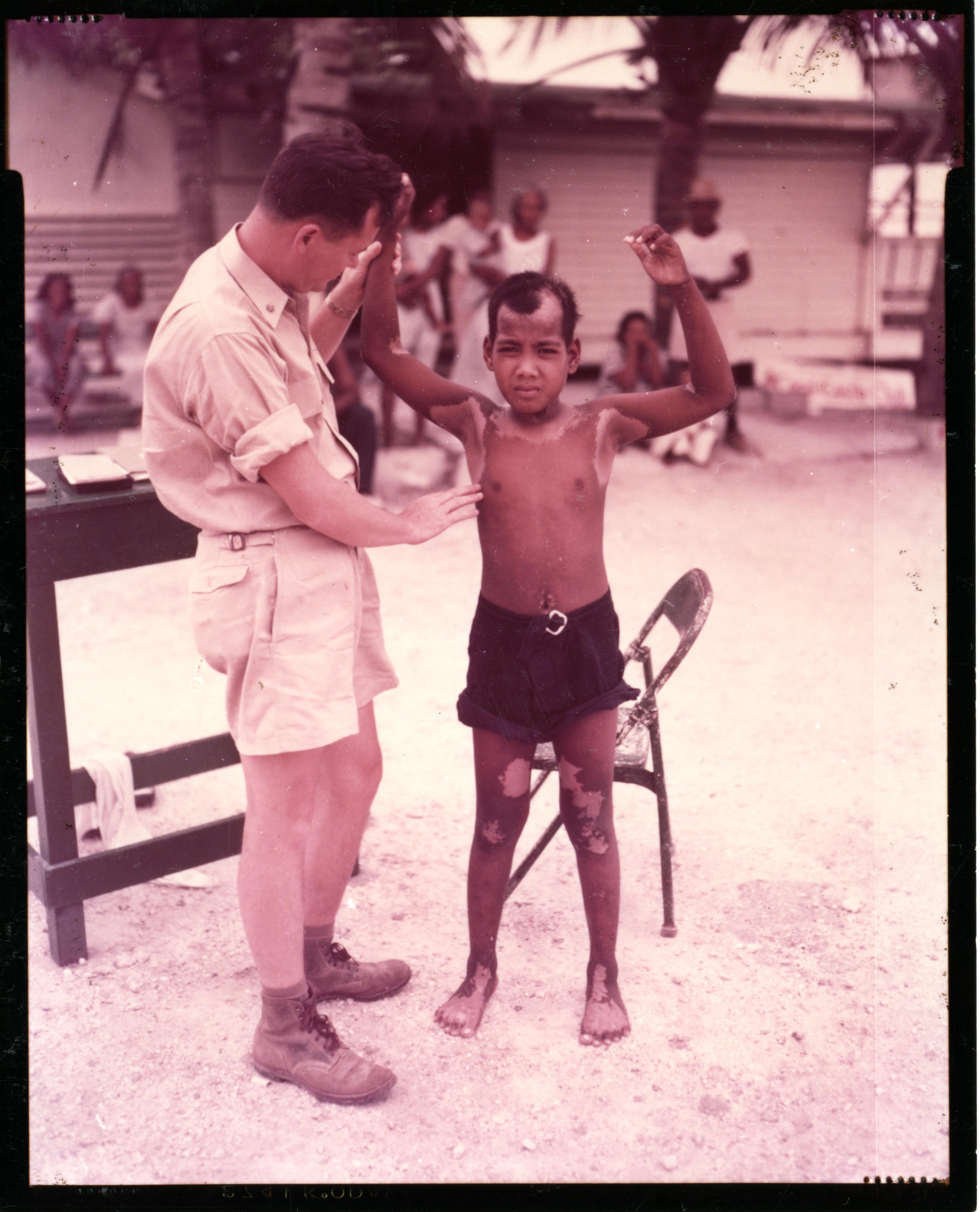 Dr. Conrad Examines Native Boy on Kwajalein